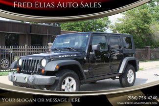 Used 2009 Jeep Wrangler Unlimited Rubicon w/ Dual Top Group image 1