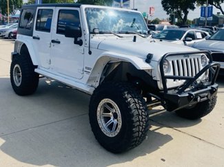 Used 2014 Jeep Wrangler Unlimited Sport image 1