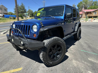 Used 2009 Jeep Wrangler Unlimited Rubicon w/ Dual Top Group image 1