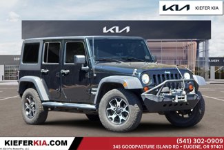 Used 2012 Jeep Wrangler Unlimited Sport w/ Black Appearance Group image 1