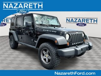 Used 2010 Jeep Wrangler Unlimited Rubicon w/ Dual Top Group image 1