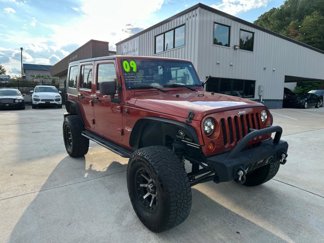 Used 2009 Jeep Wrangler Unlimited Sahara w/ Dual Top Group image 1