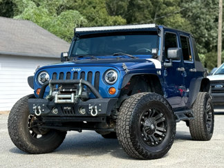 Used 2010 Jeep Wrangler Unlimited Sport image 1