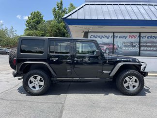 Used 2012 Jeep Wrangler Unlimited Rubicon w/ Dual Top Group image 1