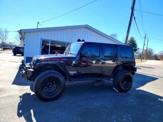 Used 2011 Jeep Wrangler Unlimited Rubicon w/ Dual Top Group image 1