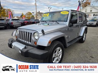 Used 2013 Jeep Wrangler Unlimited Sahara w/ Dual Top Group image 1