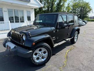 Used 2014 Jeep Wrangler Unlimited Sahara w/ Dual Top Group image 1