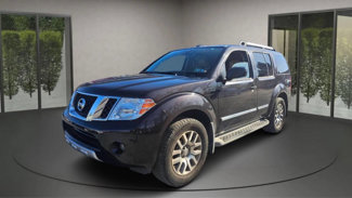 Used 2012 Nissan Pathfinder LE image 1
