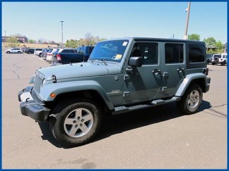 Used 2014 Jeep Wrangler Unlimited Sahara w/ Dual Top Group image 1