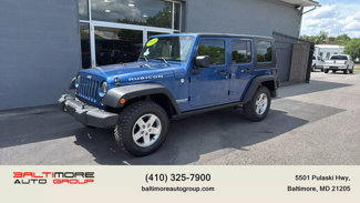 Used 2010 Jeep Wrangler Unlimited Rubicon w/ Dual Top Group image 1
