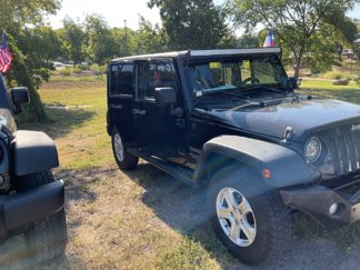Used 2013 Jeep Wrangler Unlimited Sport image 1