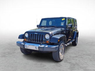 Used 2012 Jeep Wrangler Unlimited Sahara w/ Dual Top Group image 1
