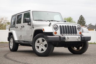 Used 2010 Jeep Wrangler Unlimited Sahara w/ Dual Top Group image 1