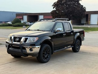 Used 2010 Nissan Frontier LE image 1