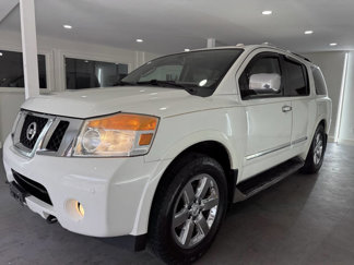 Used 2011 Nissan Armada Platinum w/ 2nd Row Captain Seat Pkg image 1