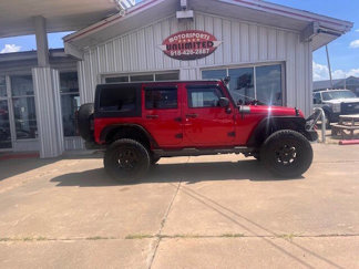 Used 2012 Jeep Wrangler Unlimited Sport image 1