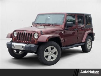 Used 2010 Jeep Wrangler Unlimited Sahara w/ Dual Top Group image 1