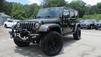Used 2012 Jeep Wrangler Unlimited Sport image 1