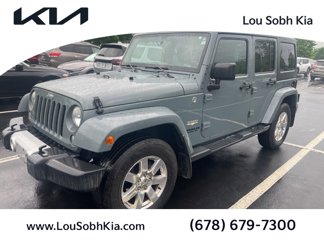 Used 2014 Jeep Wrangler Unlimited Sahara w/ Max Tow Package image 1