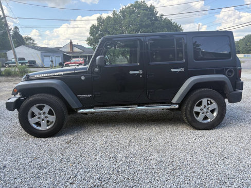 Used 2011 Jeep Wrangler Unlimited Rubicon w/ Dual Top Group image 11