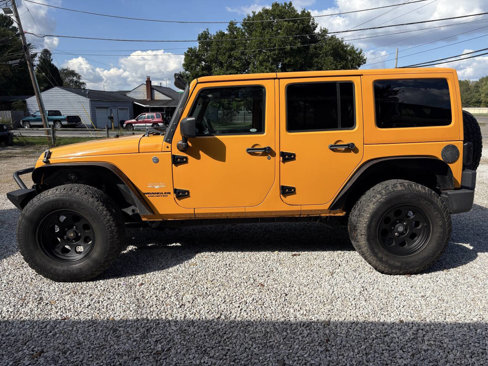Used 2012 Jeep Wrangler Unlimited Sahara w/ Dual Top Group image 11