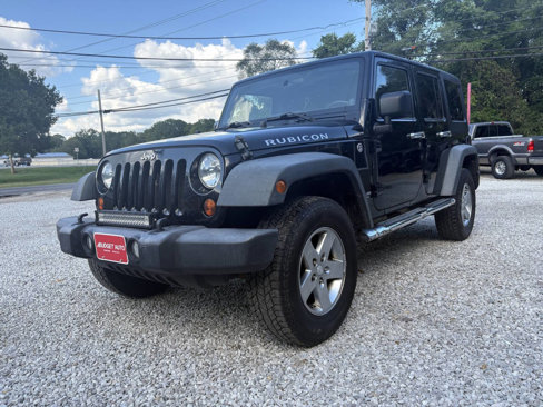 Used 2011 Jeep Wrangler Unlimited Rubicon w/ Dual Top Group image 1