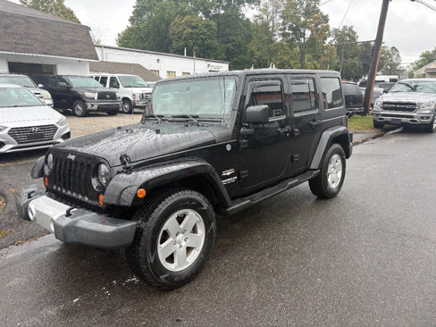 Used 2010 Jeep Wrangler Unlimited Sahara w/ Dual Top Group image 1
