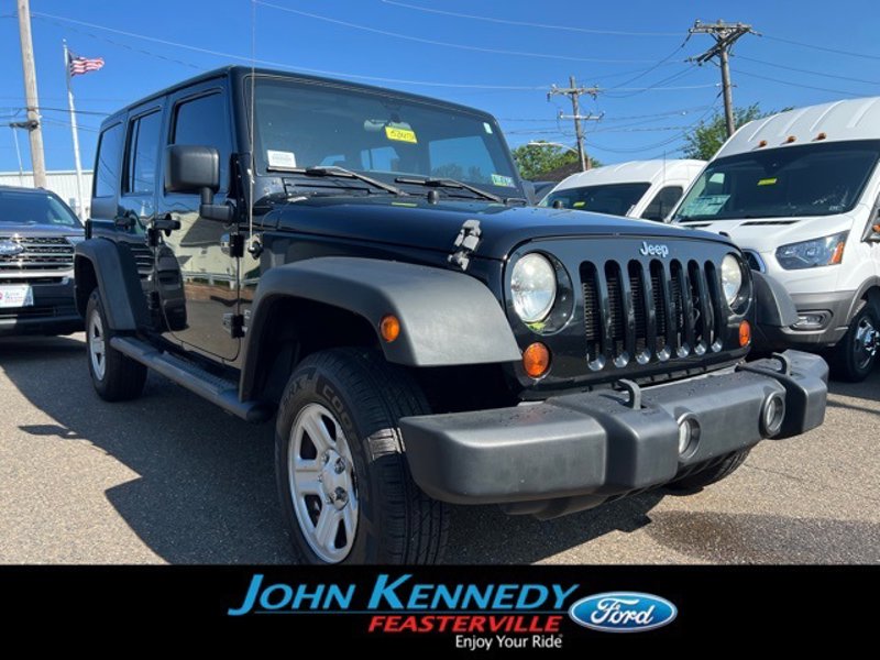 Used 2013 Jeep Wrangler Unlimited Sport w/ Mopar Black Appearance Group image 1